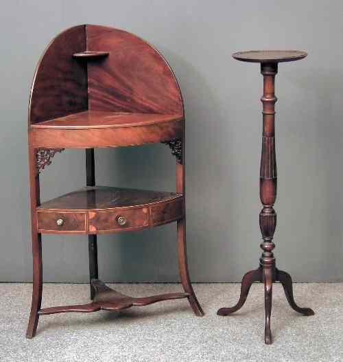 Appraisal: A George III mahogany bow-front three tier corner washstand the