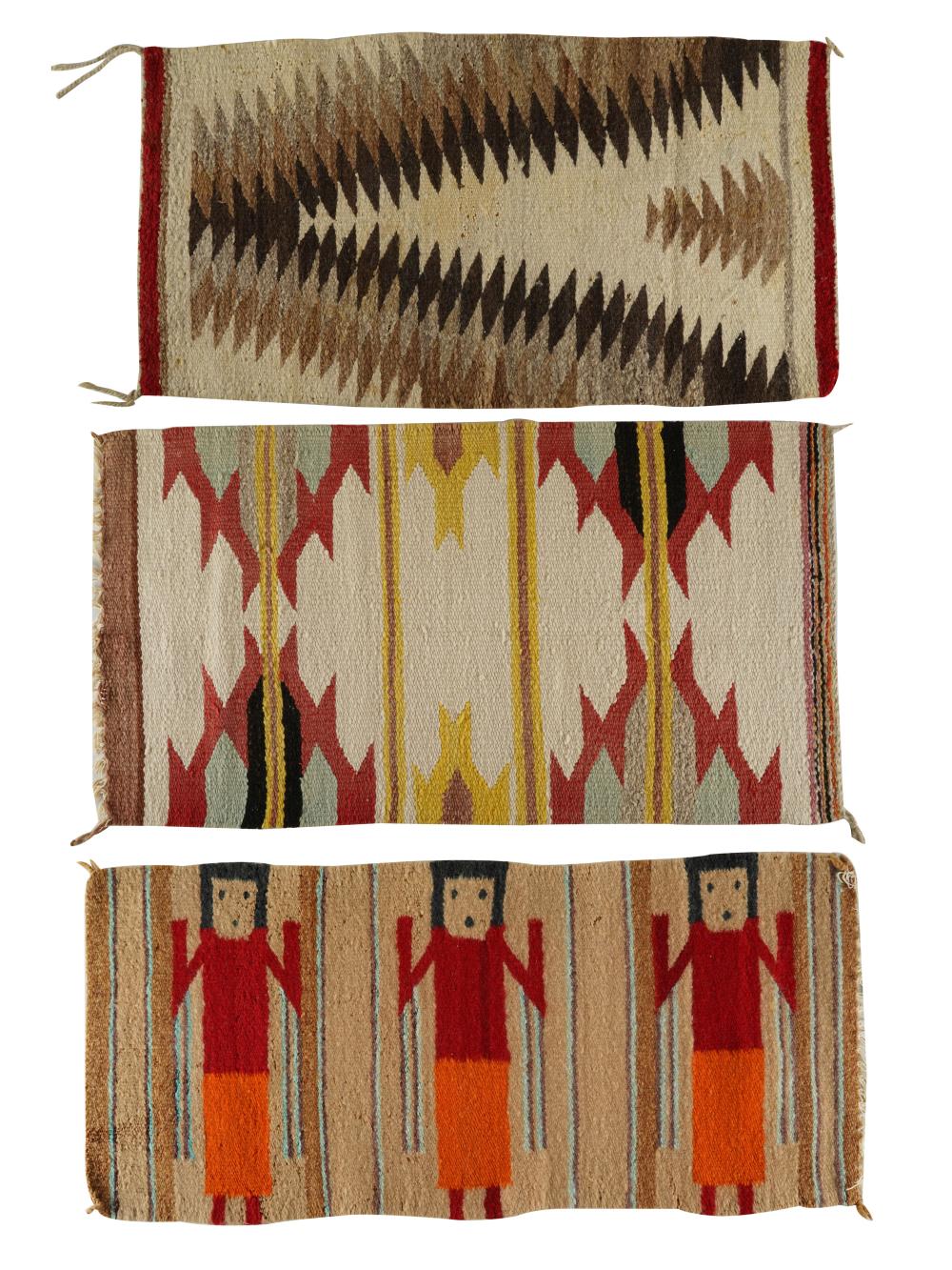 Appraisal: THREE NAVAJO WOOL RUGSthe first woven with figures x inches