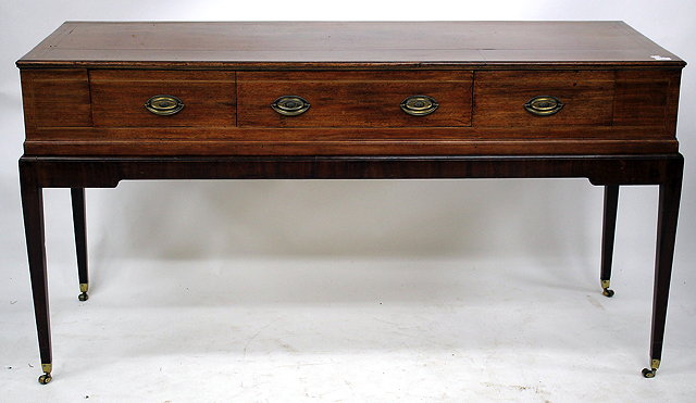 Appraisal: A MAHOGANY SIDEBOARD with three drawers and standing on square