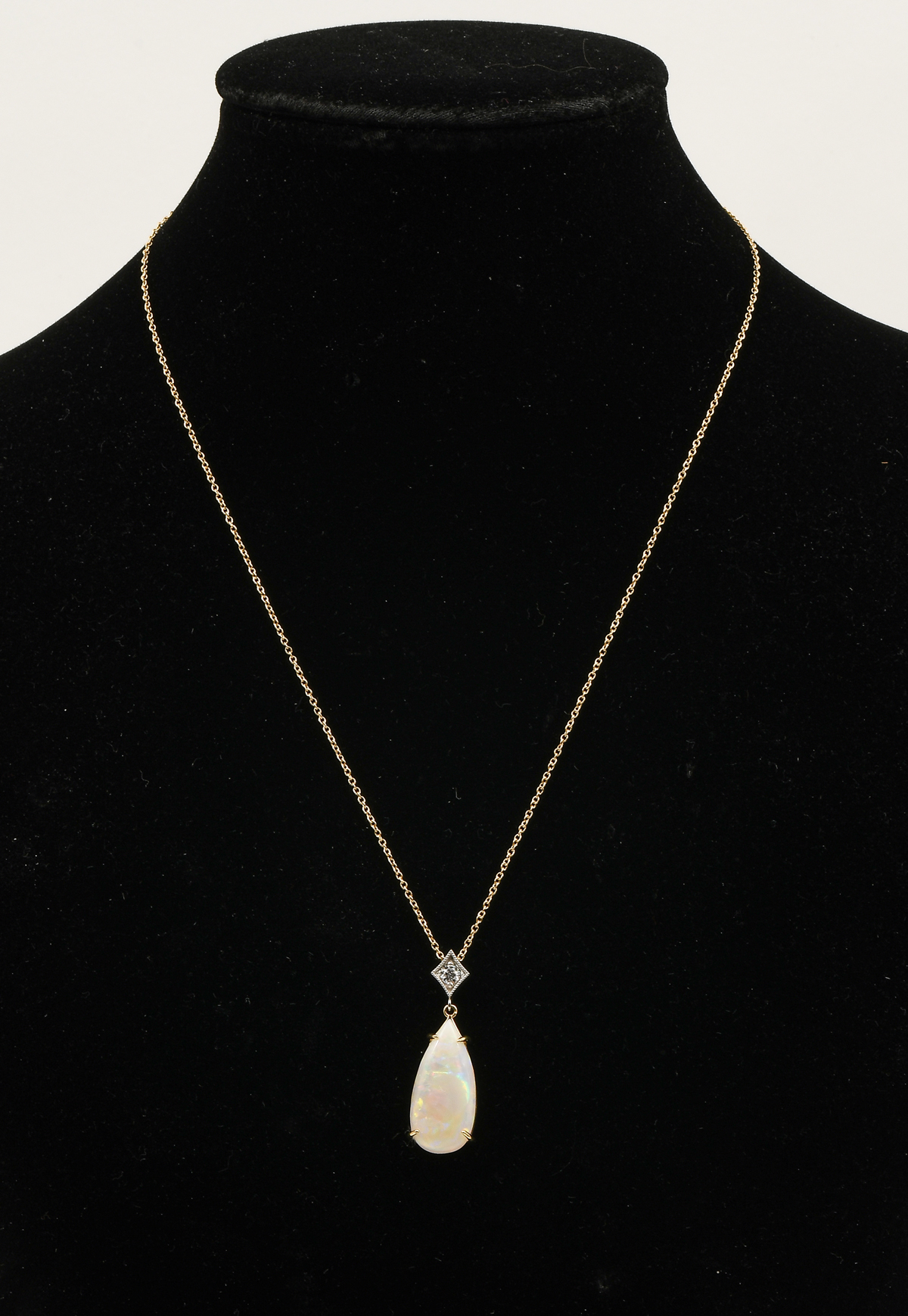 Appraisal: K OPAL DIAMOND PENDANT K yellow gold pendant contains one