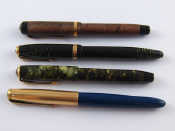 Appraisal: A Parker two other Parker pens and an Osmiroid