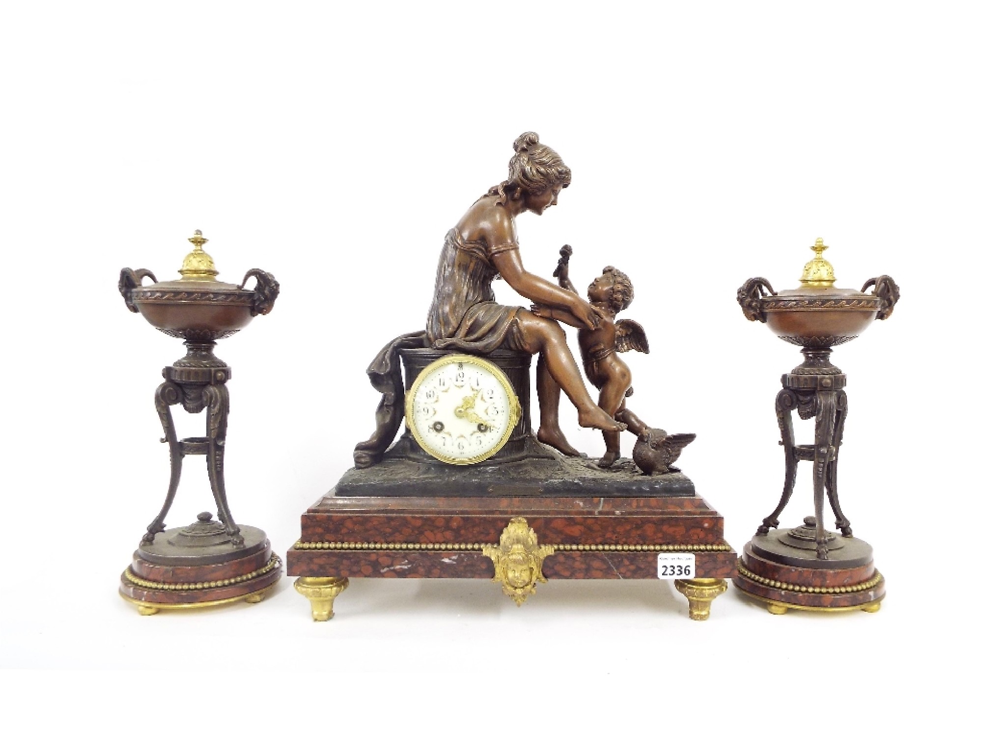 Appraisal: Rouge marble and spelter two train figural mantel clock garniture