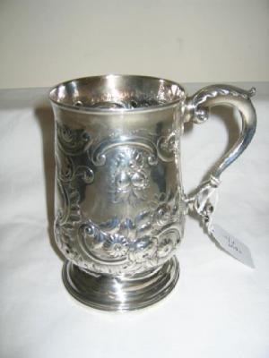 Appraisal: A GEORGIAN TANKARD of baluster form with leaf capped double