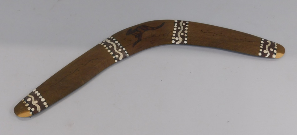 Appraisal: An Australian Aboriginal boomerang with pokerwork decoration of a kangaroo