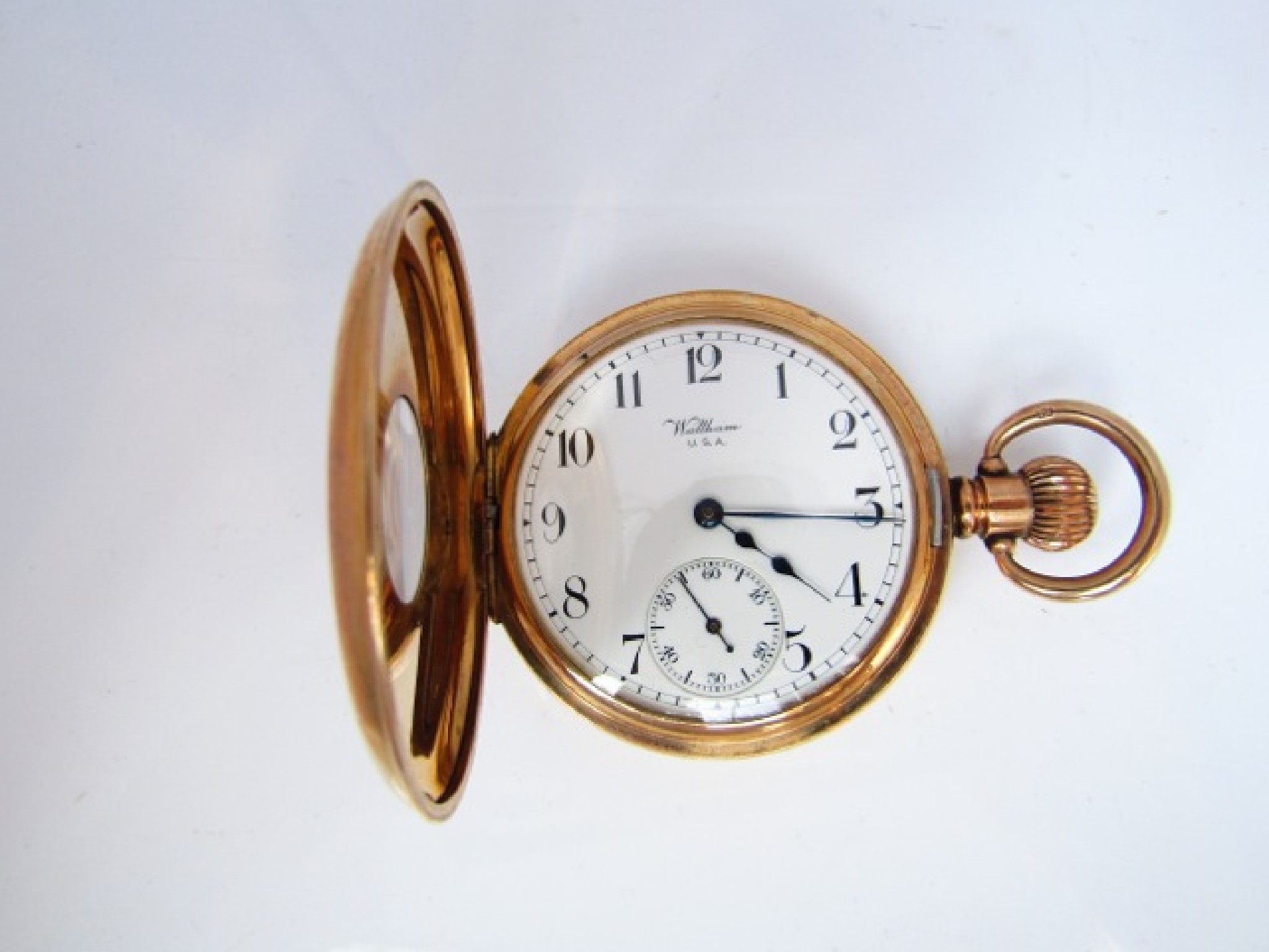 Appraisal: An American rose gold-plated half-hunter pocket watch Waltham U S