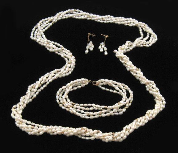 Appraisal: FOUR PIECE PEARL AND YELLOW GOLD JEWELRY SET including multi-strand