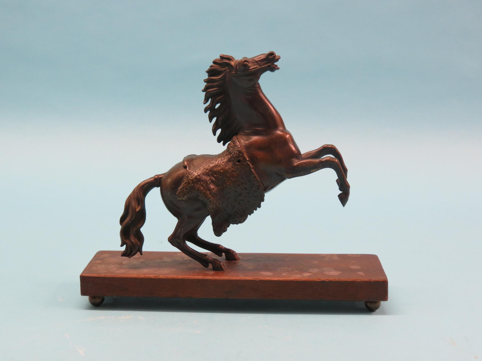 Appraisal: A bronze rearing horse unsigned on oak plinth in high