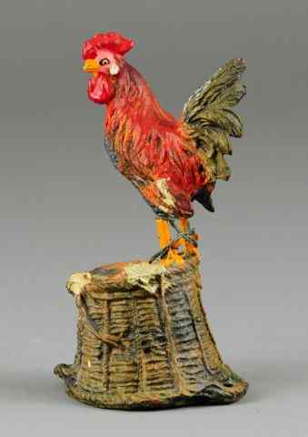 Appraisal: ROOSTER ON BASKET STILL BANK Hausser Germany c composition hand