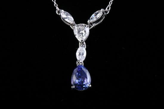 Appraisal: PLATINUM TANZANITE AND DIAMOND DROP PENDANT V set with marquise