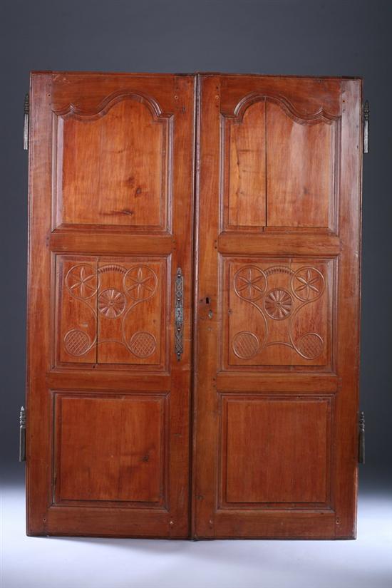 Appraisal: PAIR FRENCH PROVINCIAL CHERRY PANELLED ARMOIRE DOORS th century with