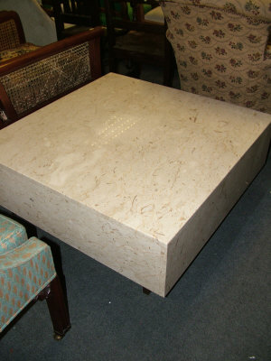 Appraisal: A variegated marble table of square form upon square sectional