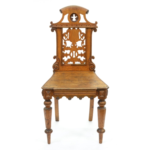 Appraisal: A Victorian Elizabethan Revival oak hall chair with pierced back