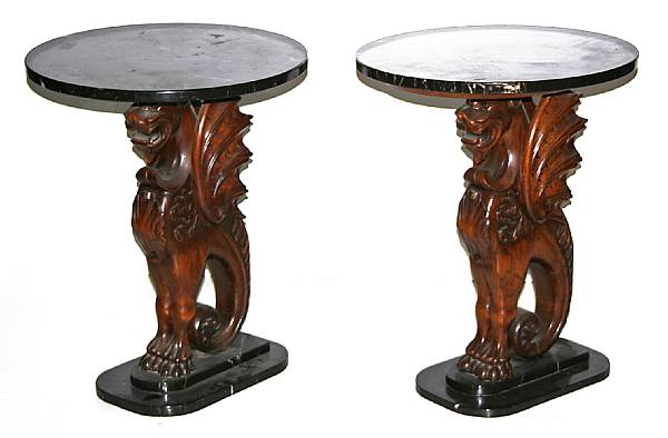 Appraisal: A pair of carved oak griffon form marble top pedestals