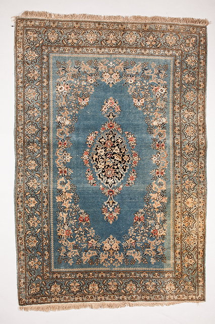 Appraisal: A PERSIAN QUM PART SILK RUG with a central foliate