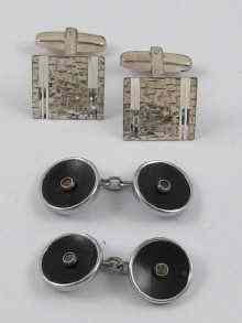 Appraisal: A pair of hallmarked silver cufflinks together with a metal