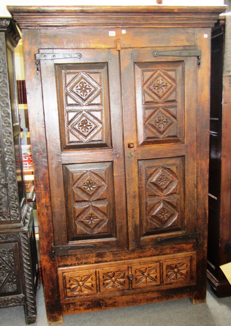 Appraisal: A th century Spanish chestnut cupboard with pair of leaf