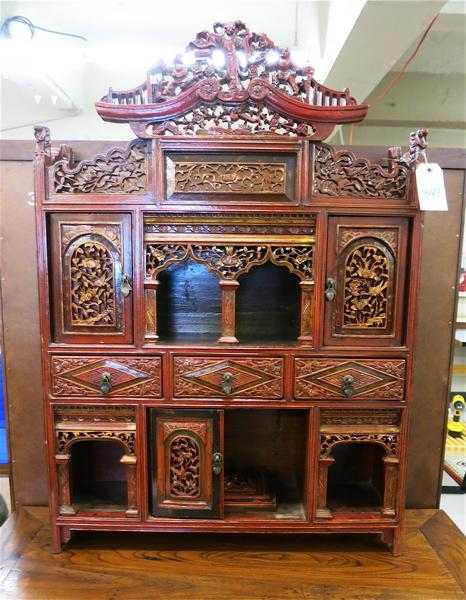 Appraisal: CHINESE CARVED AND PAINTED WOOD SHRINE CABINET the front with