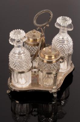 Appraisal: A George III four-piece silver cruet stand Samuel Hennell London