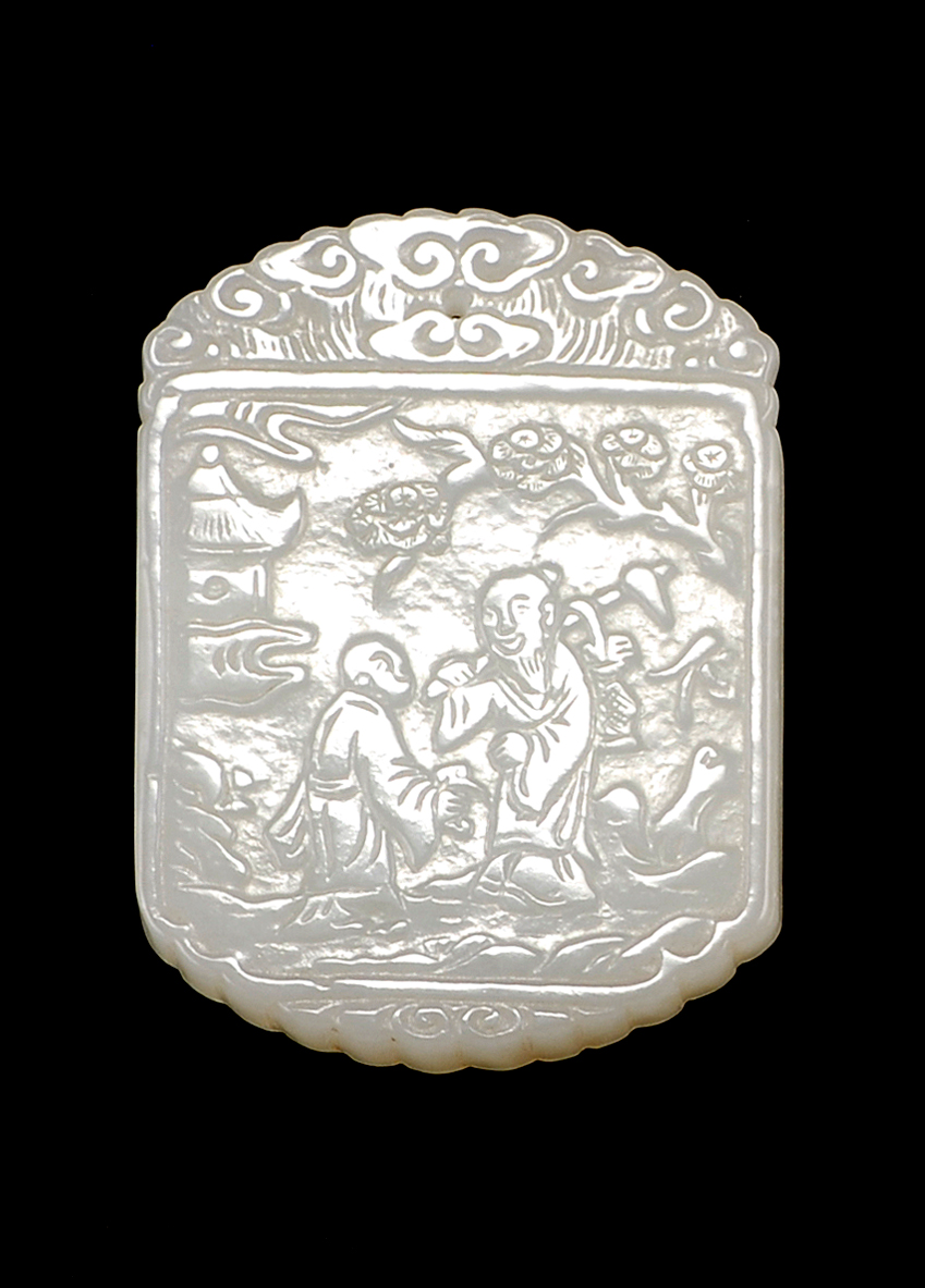 Appraisal: WHITE JADE PENDANT In modified rectangular form With relief carving