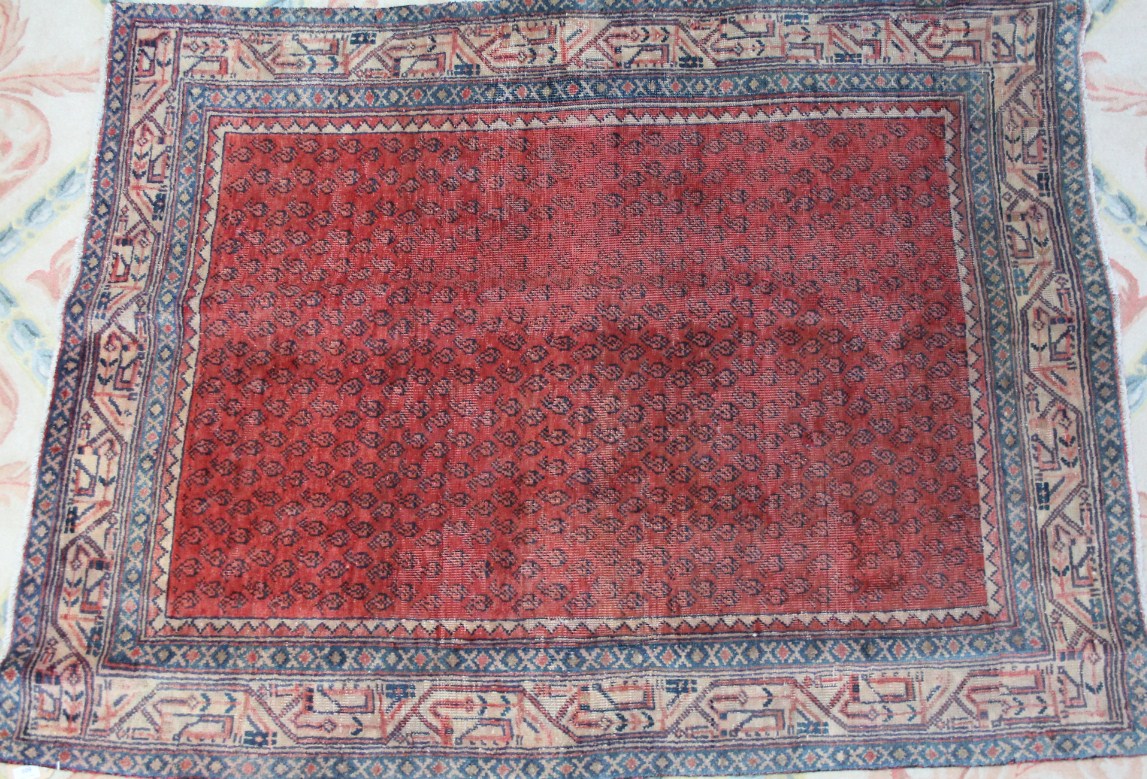 Appraisal: An Arak rug repeated pattern in red and cream cm