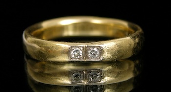 Appraisal: An k Gold and Diamond Band k yellow gold band