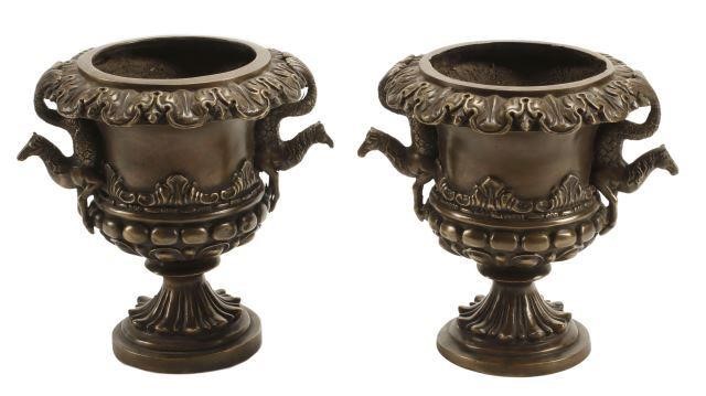 Appraisal: pair Pompeian style patinated bronze urns with figural handles approx