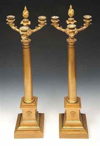 Appraisal: A PAIR OF EMPIRE GILT BRONZE THREE BRANCH CANDELABRA with