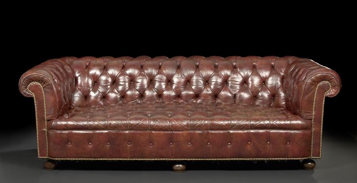 Appraisal: Edwardian Mahogany and Leather-Upholstered Chesterfield Sofa early th century the