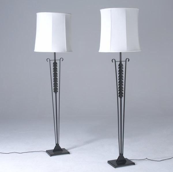 Appraisal: MODERN Pair of cast iron floor lamps with faceted white