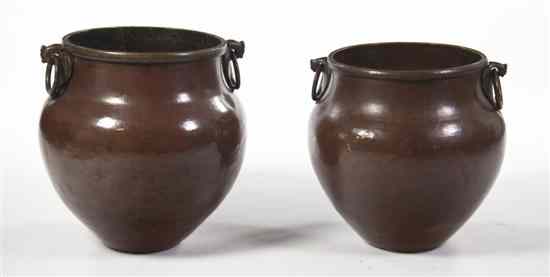 Appraisal: A Pair of Middle Eastern Copper Jardinieres each of tapering