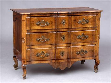 Appraisal: LOUIS XV PROVINCIAL COMMODE The undulating solid walnut top above