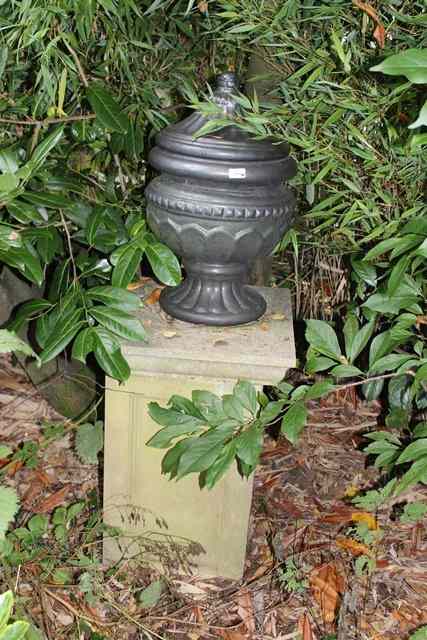 Appraisal: A BLACK GLAZED TERRACOTTA FINIAL in the form of a