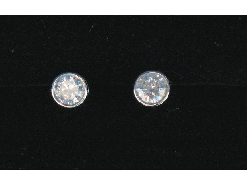 Appraisal: A PAIR OF DIAMOND SOLITAIRE EARRINGS the round brilliant-cut diamonds