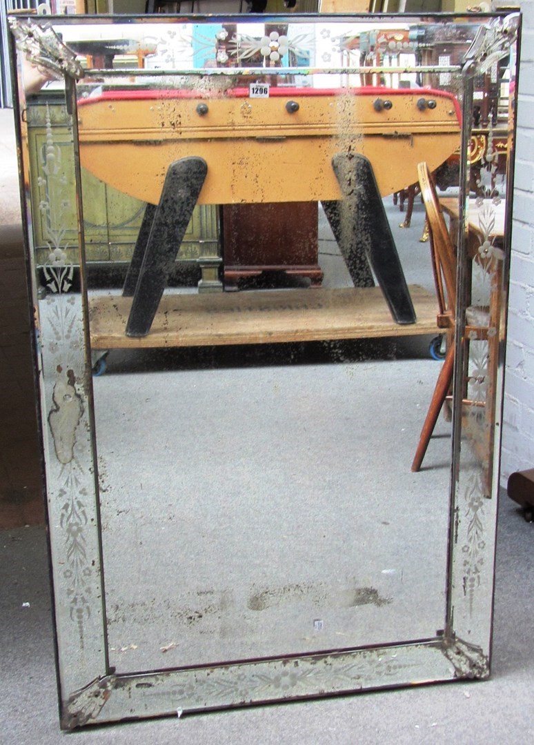 Appraisal: A th century rectangular wall mirror with floral etched border