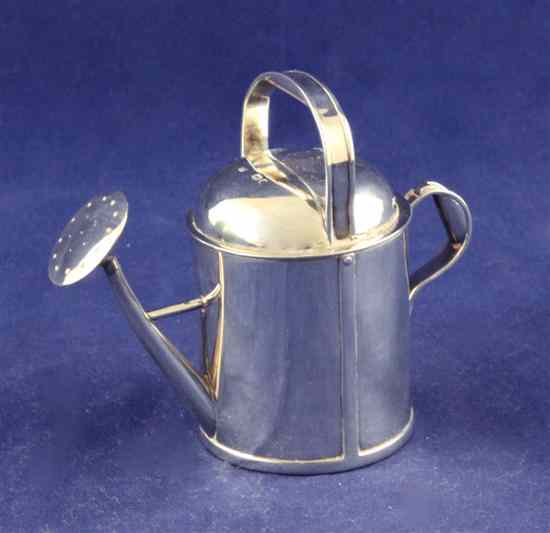 Appraisal: A late Victorian novelty silver atomiser modelled as a watering