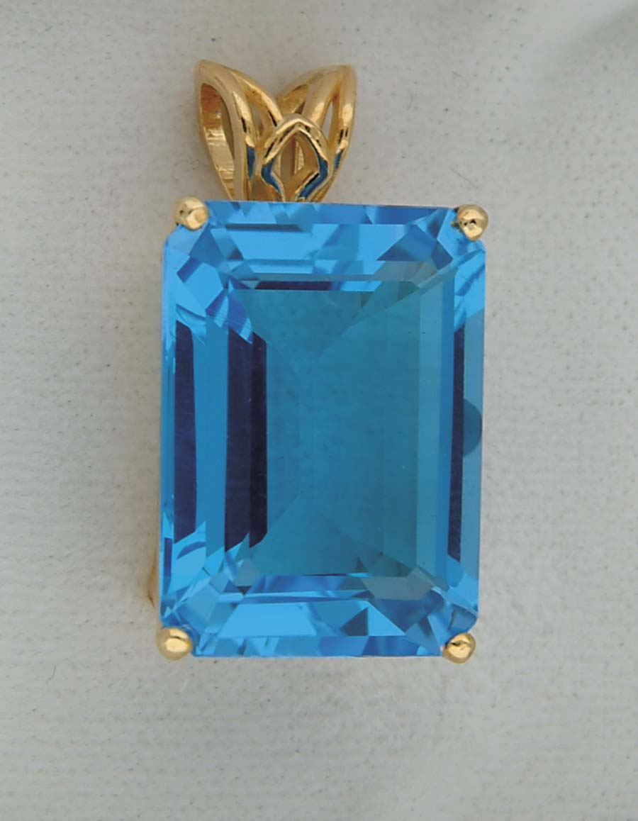 Appraisal: K YELLOW GOLD AND SWISS BLUE TOPAZ PENDANT Large x