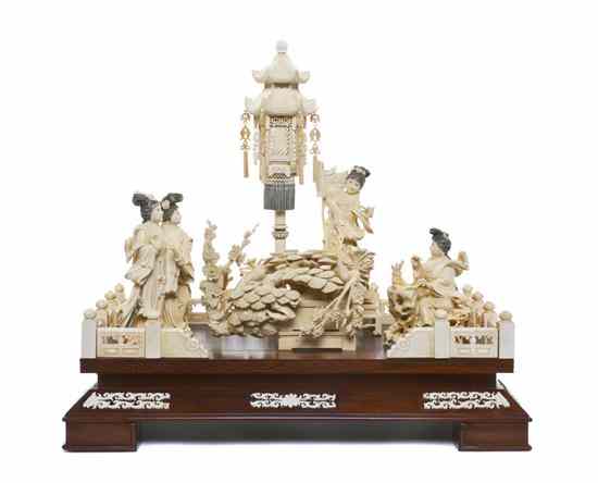 Appraisal: A Chinese Carved Ivory Figural Group the arrangement centered on