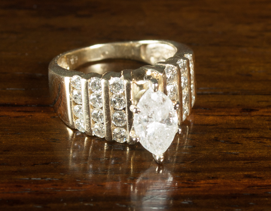 Appraisal: DIAMOND AND FOURTEEN KARAT GOLD RING with twelve round-cut diamonds