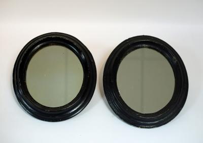 Appraisal: A pair of oval wall mirrors with papier-m ch frames