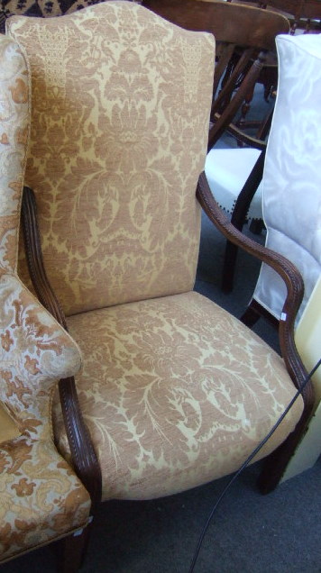 Appraisal: An th century mahogany framed open armchair the hump crest