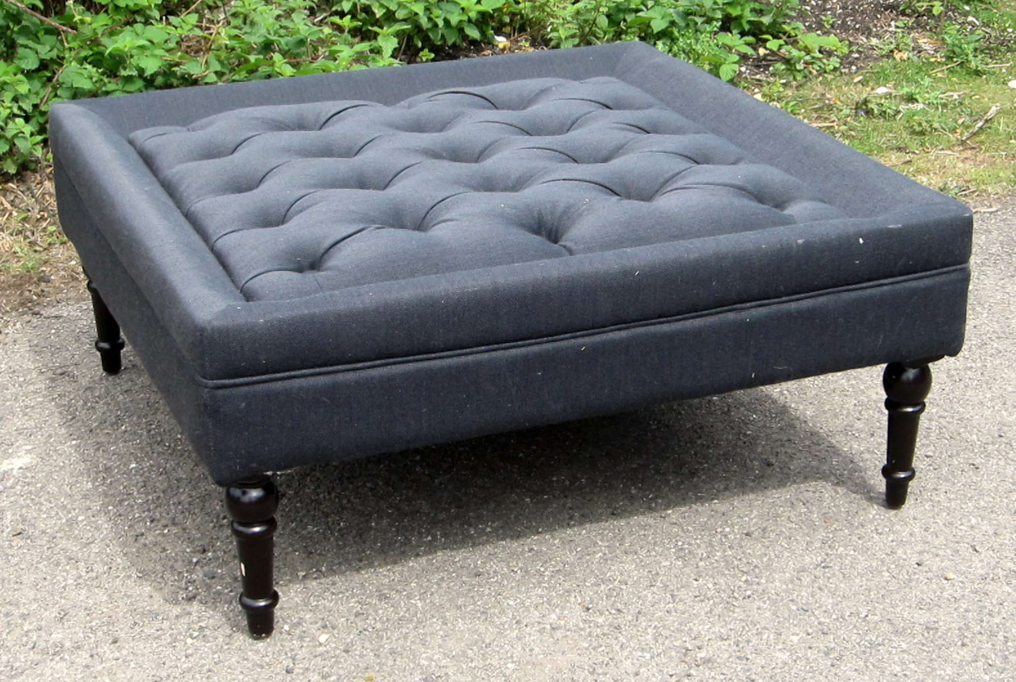 Appraisal: Grey button upholstered square footstool on turned wooden legs