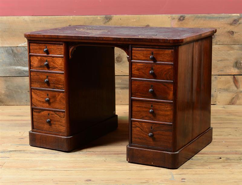 Appraisal: VICTORIAN ROSEWOOD PARTNER'S DESK Fitted with leather top niche surrounded