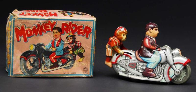 Appraisal: Tin Monkey Rider Motorcycle Wind-Up Toy Description Japanese Working When