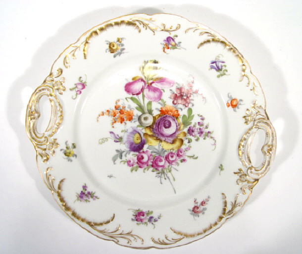 Appraisal: Dresden porcelain plate hand painted with flowers onto a gilt