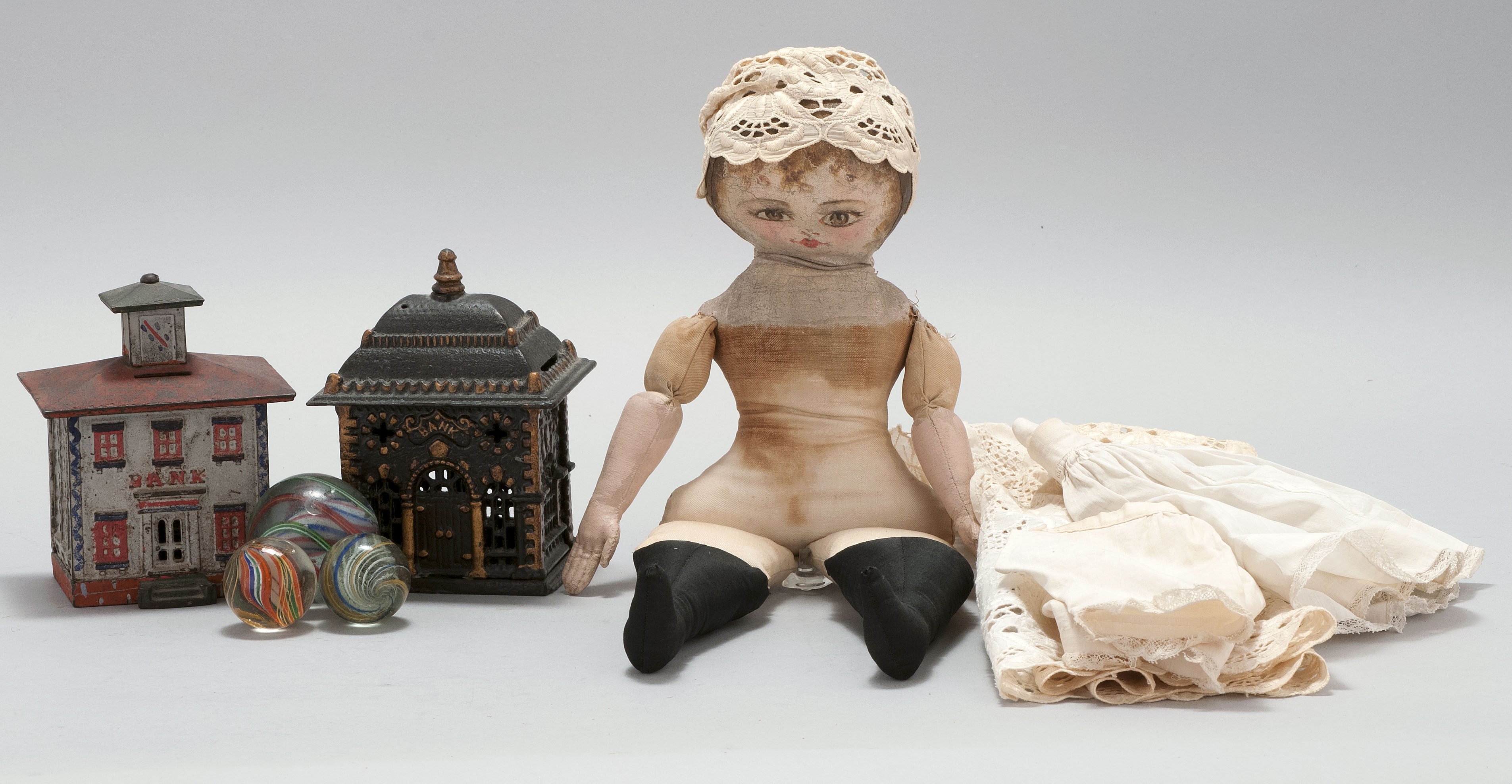 Appraisal: SEVEN CHILDREN'S TOYS Includes A th Century oilcloth doll with