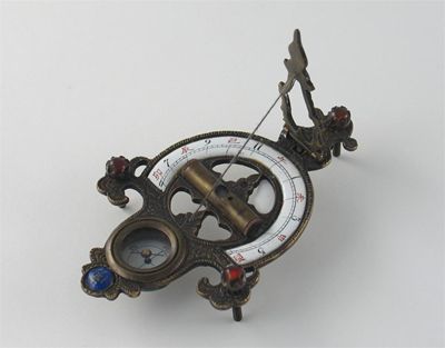 Appraisal: A Chinese metal and enamel travelling sundial with an integral