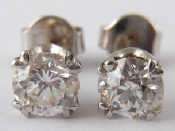 Appraisal: A pair of white metal tests carat gold diamond ear