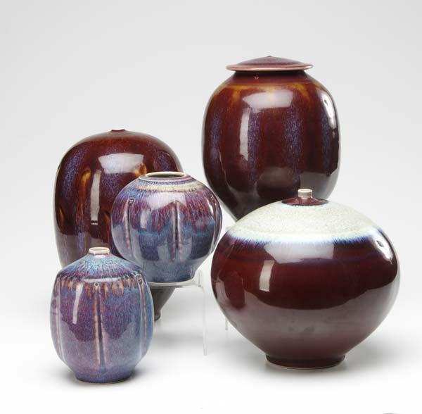 Appraisal: TOM TURNER Five porcelain vessels covered in oxblood and purple