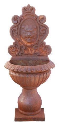 Appraisal: Cast iron wall-mounted garden fountain central cartouche with tiger mask