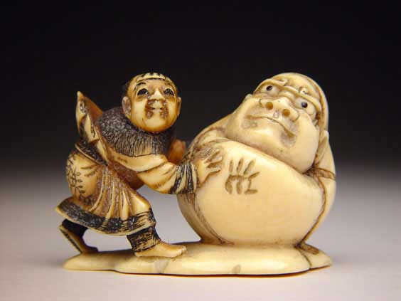 Appraisal: ANTIQUE IVORY NETSUKE Antique carved ivory netsuke of a karako